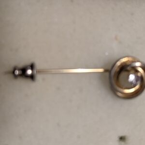 Elegant Gold Knot Brooch with Silver Accents